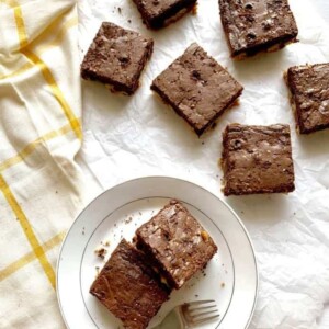Cookie brownie bars, cut and served on plate