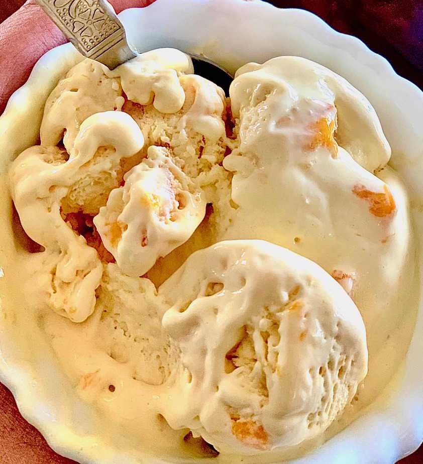 scoops of mango ice cream in a bowl