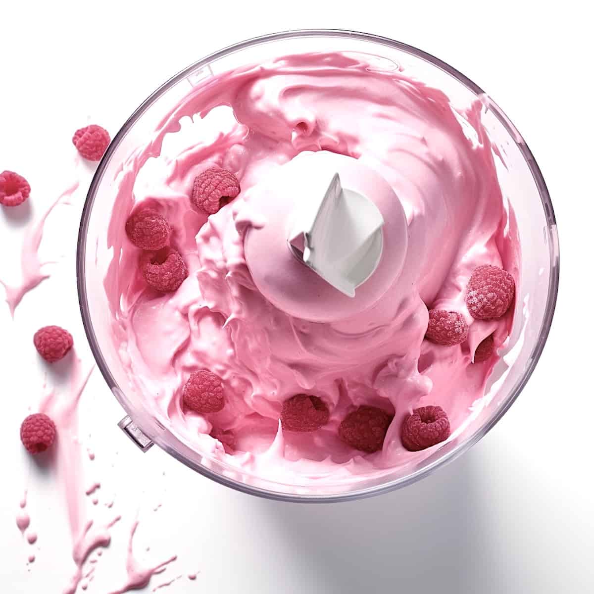 churning white chocolate raspberry ice cream 